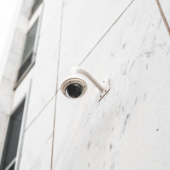 white round light bulb on white concrete wall