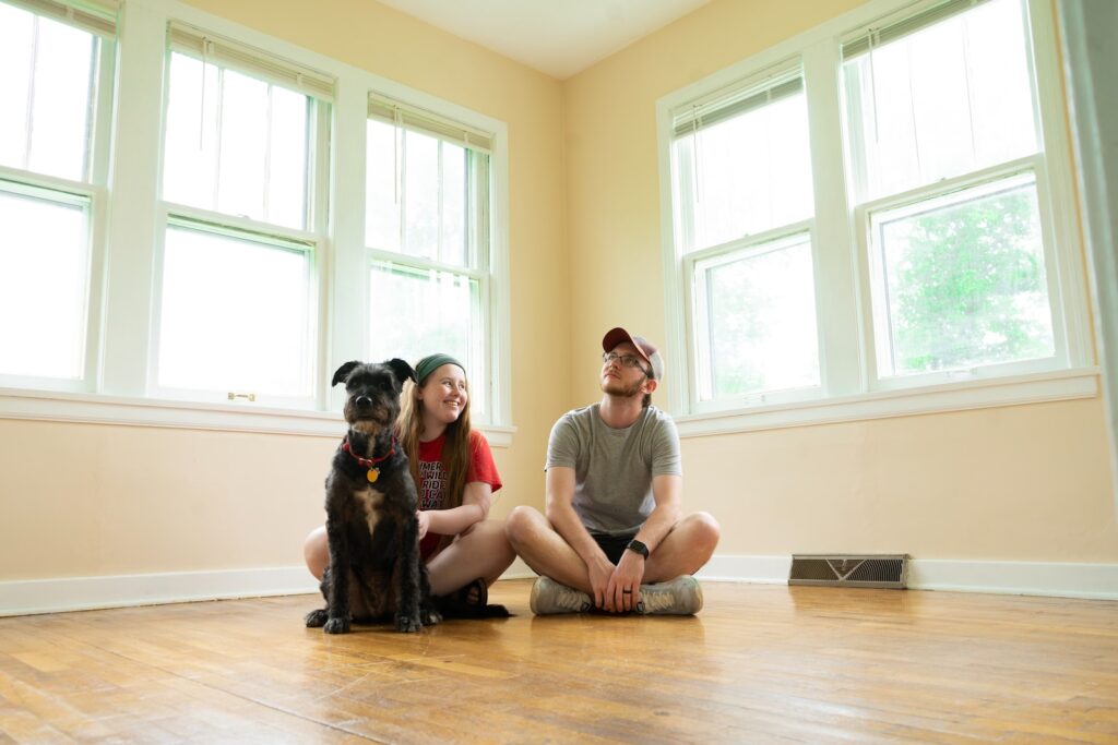 Couple with dog in a new home